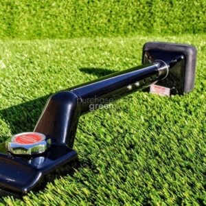 installer using a stake to secure turf