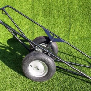 installer using a stake to secure turf